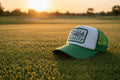 Touch Grass Trucker Hat side angle showing kelly green mesh back